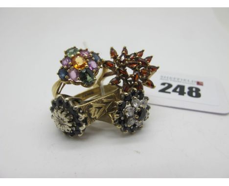 A 9ct Gold Cluster Dress Ring, of abstract design, claw set (finger size K1/2); together with three further 9ct gold cluster 