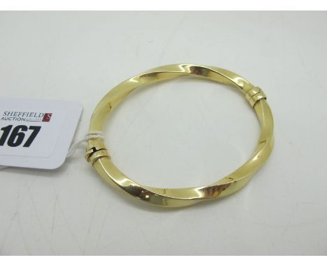 A Modern Hinged Bangle, stamped "585". 