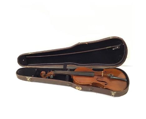 A German violin, c. 1900, with two piece back and bearing "Antonius Stradivarius" paper label, cased with an unmarked bow (a/