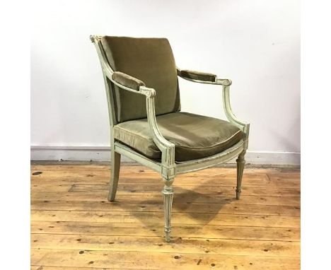 A French painted fauteuil, c. 1900, with fluted roller top rail and downswept arms enclosing a padded back and seat with velv