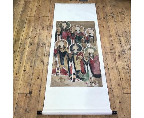 A Chinese scroll painting, on silk, depicting six Deities or Immortals. Panel 106cm by 58cm, overall 175cm by 70cm