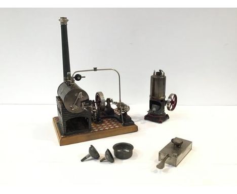 A Gebruder Bing tinplate toy stationary steam engine, mounted on a tiled base, with maker's plaque; together with a Gebruder 
