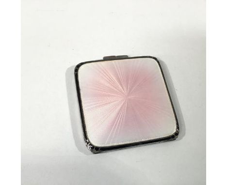 A George VI silver and engine-turned enamel compact, Adie Brothers, Birmingham 1937, square, the cover with a pale pink ename