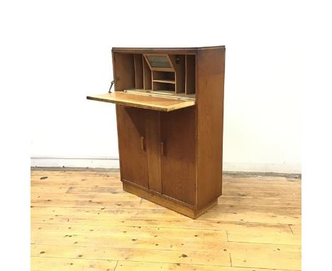 A 1930's secretaire desk by Robert John Anderson of Edinburgh, the rectangular top above a fall front enclosing a light box, 