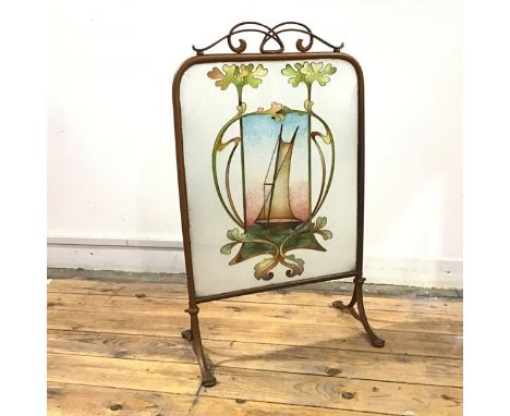 An Art Nouveau painted metal and beadwork fire screen, the pierced crest above a banner depicting a sailing ship, on trestle 