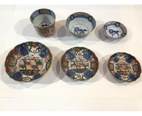 A group of Chinese Imari porcelain, comprising a graduated set of three shallow footed bowls, each with six character undergl