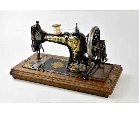 JONES; a vintage manual sewing machine in case.