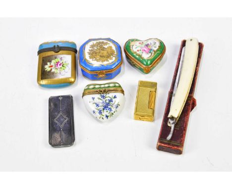 Four porcelain trinket boxes including a hand painted example with jewelled decoration, a Limoges example, a Dunhill lighter,