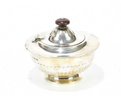 THOMAS BRADBURY &amp; SONS; a George V hallmarked silver tea caddy of circular form, with gadrooned decoration, Sheffield 192