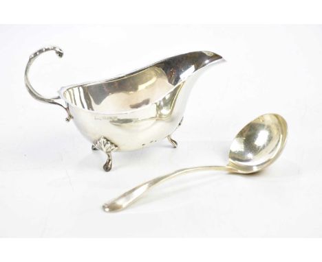 An Elizabeth II hallmarked silver sauce boat, Birmingham 1967, with ladle, Sheffield 1965, combined approx. 3.62ozt.112.5g (2