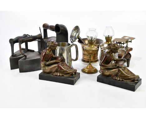 A pair of bronzed ceramic bookends of classical maidens reading, a small pair of brass oil lamps, a pewter tankard and simila