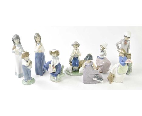 LLADRO; a figure of a girl holding a basket of flowers, height 18cm, and eight Nao figures (9).Condition Report: Good conditi