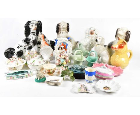 A collection of 19th century and later ceramics, including various Staffordshire spaniels, a Staffordshire spaniel on a cushi