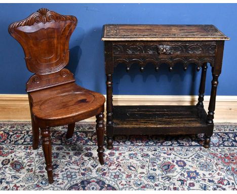 A 1920s carved oak side table in the Flemish style with a single drawer above shelf, width 74cm, depth 32cm, and a Victorian 