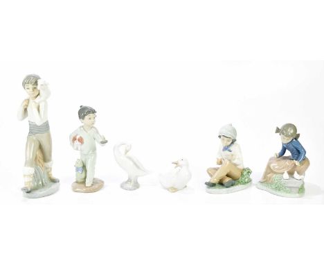 NAO; a group of four figures to include duck, seated boy, seated girl and young boy and dog, together with a Lladro swan and 