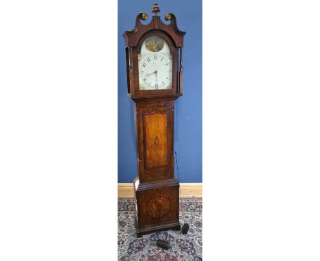 A 19th century oak longcase clock, the painted dial depicting a boy gathering hay above the chapter ring bearing Arabic numer