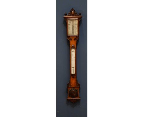 J H STEWARD; a Victorian carved oak stick barometer with applied floral decoration, height 110cm.