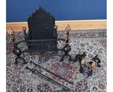 A cast iron fire grate and back, height 74cm, with cast iron and copper fire dogs, together with a companion set.
