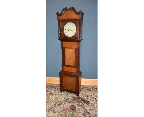 An early 19th century eight day longcase clock, the painted dial set with Arabic numerals and Roman numerals within an oak ca