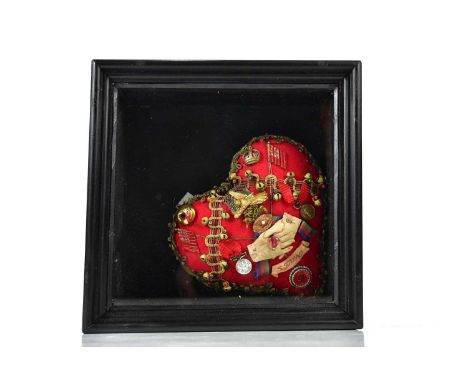 † ROZANNE HAWKSLEY; a textile sweetheart pin cushion produced to commemorate WWI, decorated with a variety of items including