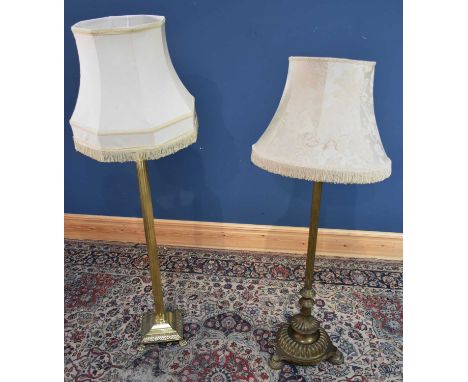 A Victorian brass adjustable standard lamp on Corinthian column, terminating on a circular plinth base, and a modern brass st