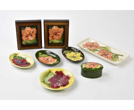 MOORCROFT; five pin dishes in the 'Coral Hibiscus' pattern, also a trinket box and cover and two plaques in the same pattern 