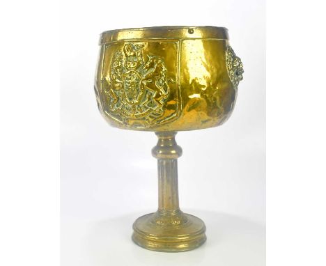A 19th century brass planter on a column, relief decorated with the Royal Crest, height 49cm.