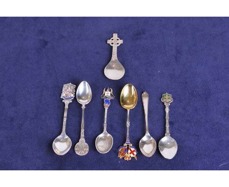 A Celtic silver caddy spoon marked Glasgow 1954, plus five silver souvenir spoons and a teaspoon