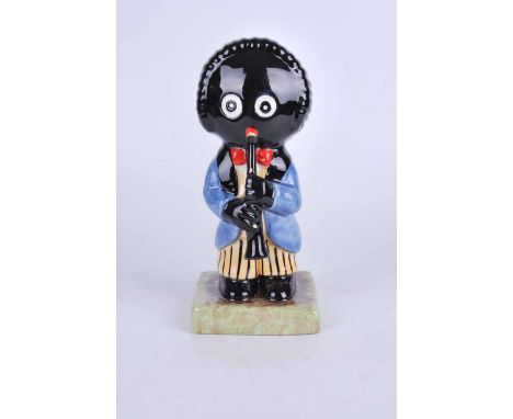Carlton ware large golly figure playing clarinet. Black backstamp, marked   Colour Trial  . 20cm high