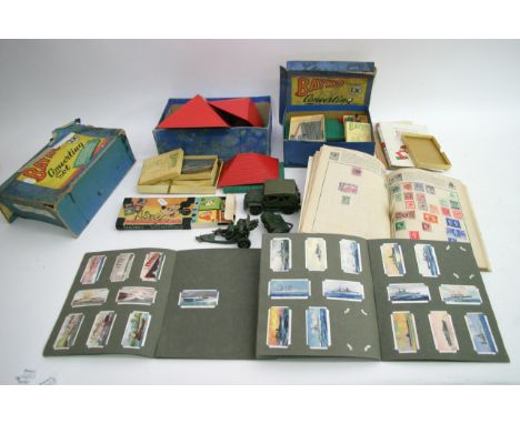 2 boxes of bayko building sets together with a boxed Disney dominoes britains gun set and cigarette cards