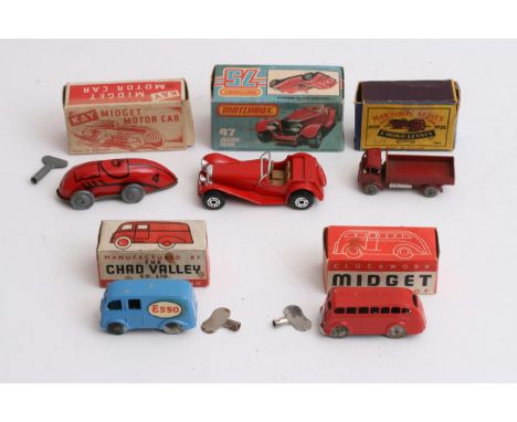 Two boxed Chad Valley 'Midget' Diecast clockwork toys (ESSO van and a red coach) together with a boxed Kay 'Midget' clockwork