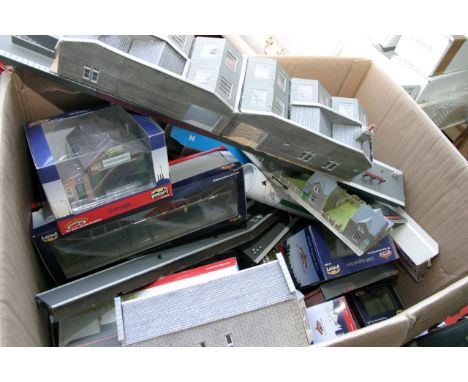 Five boxes containing an extensive collection of boxed and unboxed Bachmann 'OO' gauge buildings, houses, stations, etc.