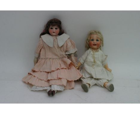 Two Bisque Headed Dolls comprising one stamped Simon &Halbig doll with expressive painted face and open mouth, another stampe