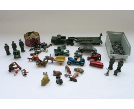 Five unboxed lead army figures together with other lead farm animals and metal figures, an unboxed Dinky transporter and a co