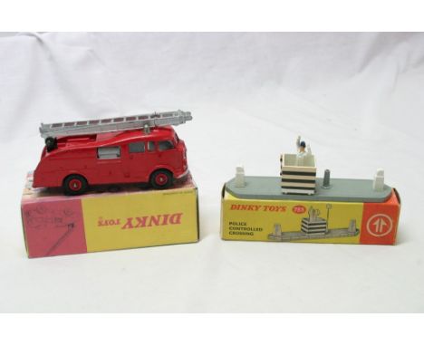 A boxed Dinky toy fire engine No.955 (not original box lid) together with a boxed Dinky police controlled crossing No.753 (be