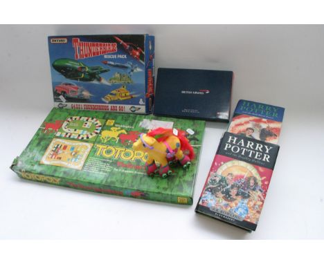 A Thunderbirds rescue pack, a boxed die cast British Airways model, two Harry Potter first edition hard back books, a My Litt