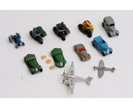 A collection of unboxed Dinky items including police and AA patrol bikes, 2 planes, a tractor, an austin saloon, and 4 other 