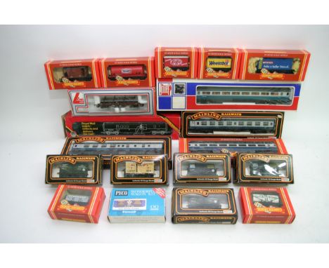 A box containing a collection of boxed Railway Carriages and goods wagons including Hornby, Jouef, Manline, Peco and Lima 