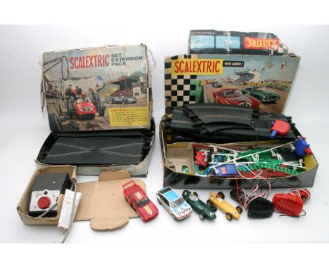 A boxed scalextric Racing set including 6 cars, track and various accessories
