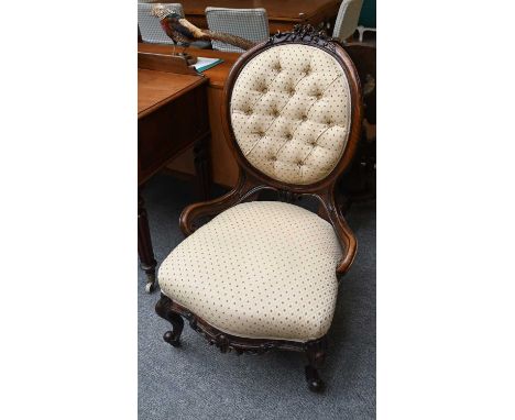A Victorian Button Back Chair, with carved mahogany frame