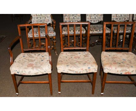 A Set of Six George III Mahogany Dining Chairs, with reeded stick backs, tapering square supports and including two carver ch