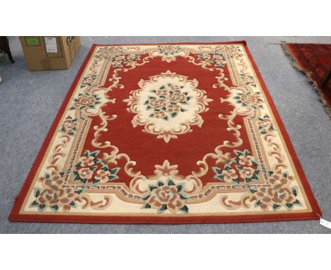 A Machine Made Carpet of Savonnerie Design, 223cm by 172cm