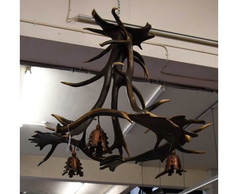 Antlers/Horns: A Red Deer and Fallow Deer Antler Chandelier, fitted with three cast metal light shades, overall height 90cm, 