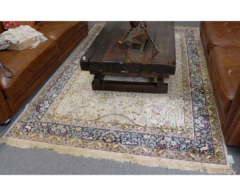 Machine Made Artificial Silk Prayer Carpet of Oriental Design, the ivory field with a one-way design of birds, animals and fl