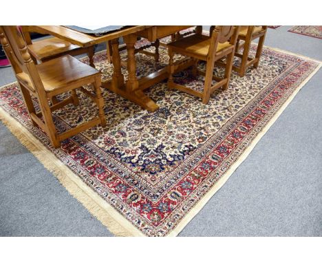 Machine Made Artificial Silk Carpet of Oriental Design, the ivory field of floral vines centred by a crimson medallion framed