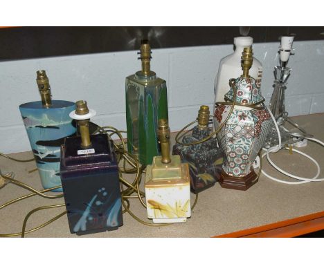 Four Studio Pottery Lustre Lamp Bases, two further studio pottery lamp bases, a glass example and another of vase form (8)