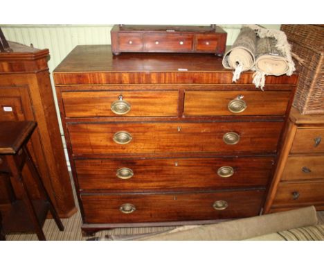 A 19TH CENTURY MAHOGANY CADDY TOPPED CHEST OF FIVE DRAWERS supported on short plain bracket feet 