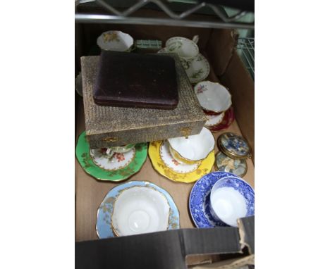 A BOX CONTAINING A SELECTION OF DOMESTIC TABLE WARES to include; tea cups &amp; saucers, cased cutlery, etc. 