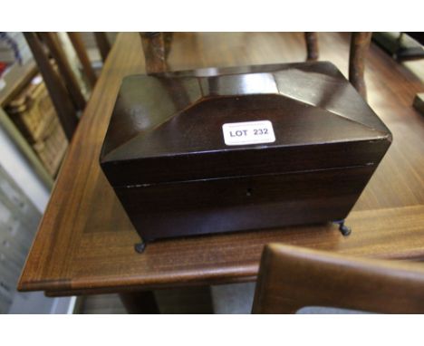 A QUALITY 19TH CENTURY MAHOGANY FINISHED SARCOPHAGUS SHAPED TEA CADDY with lion mask ring drop handles, and cast metal paw fe