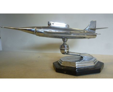 A 1950/60s chromium plated metal novelty cigarette lighter, fashioned as a fighter aircraft with a detachable central section